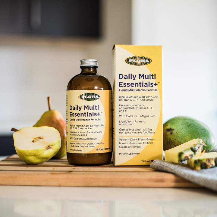 daily multivitamin including vitamins A, B1, B2, B6, B12, C, D and E plus calcium, magnesium, niacin, and iodine, made vegan and gluten-free with no artificial colors or flavors pictured with pears, pineapples, and mangos