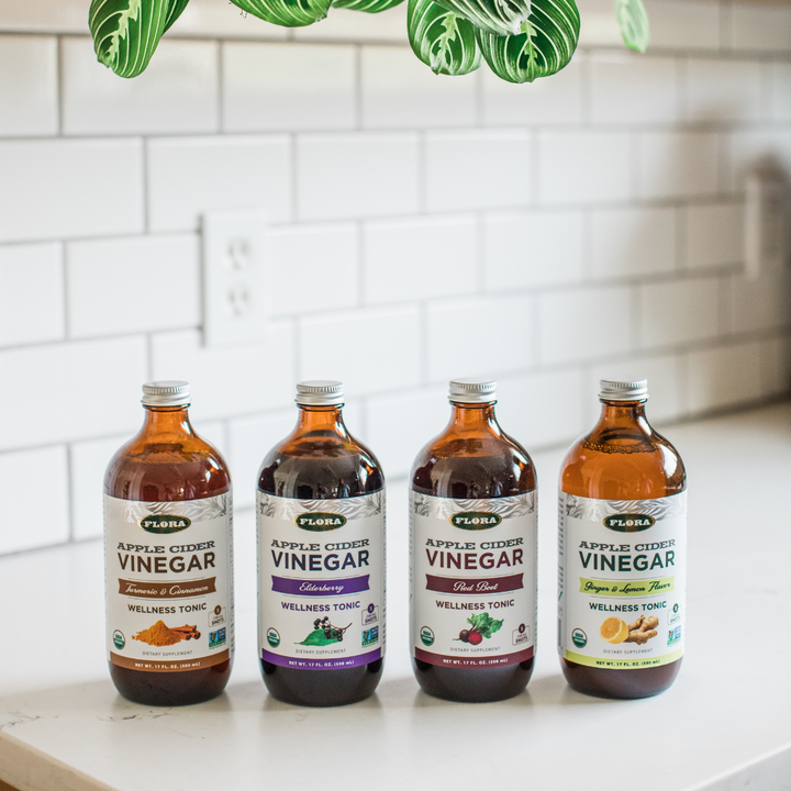 organic apple cider vinegar in four flavors by Flora Health: turmeric cinnamon, elderberry, red beet, and lemon ginger